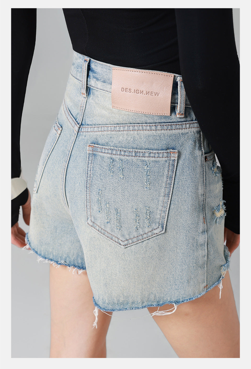 high-waisted denim shorts with frayed distressed edges