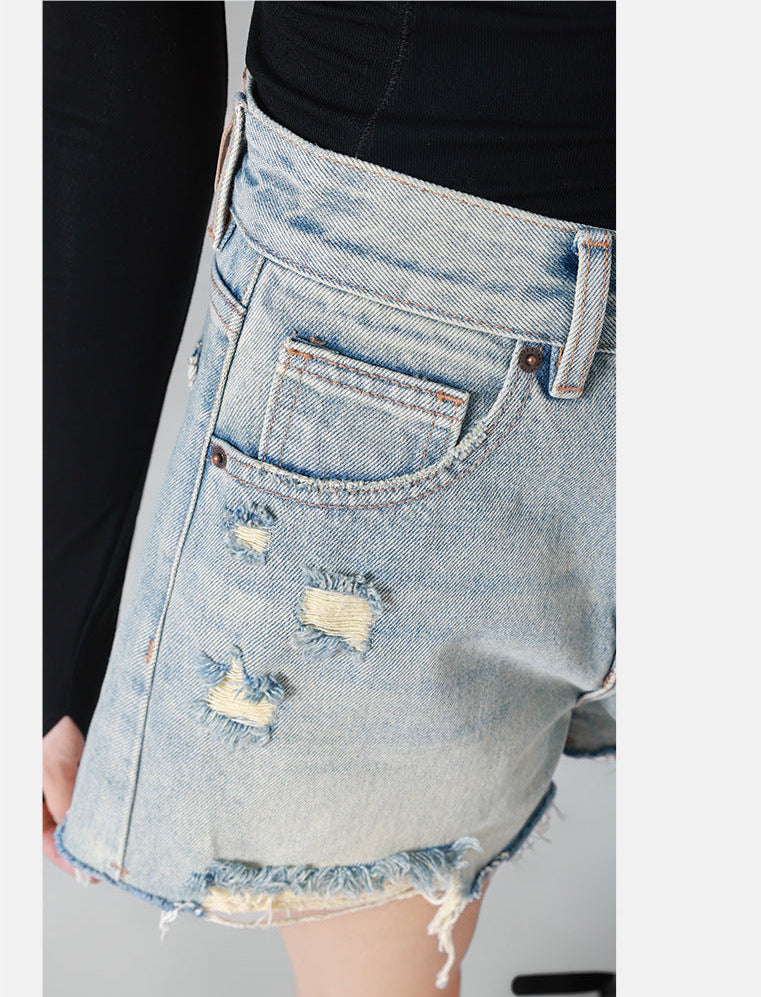 high-waisted denim shorts with frayed distressed edges