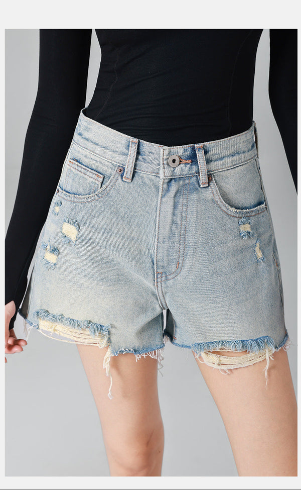 high-waisted denim shorts with frayed distressed edges